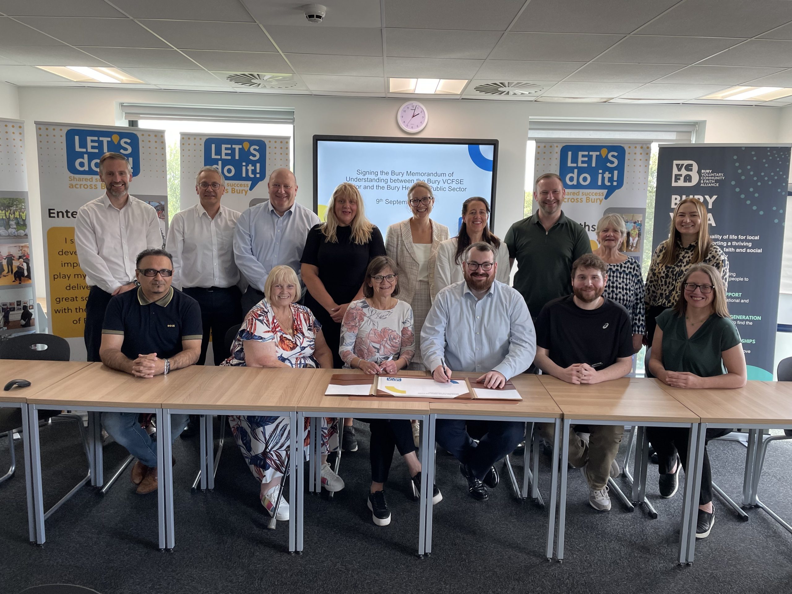 Group picture of the VCSE Leadership group signing the MoU with Public Sector colleagues