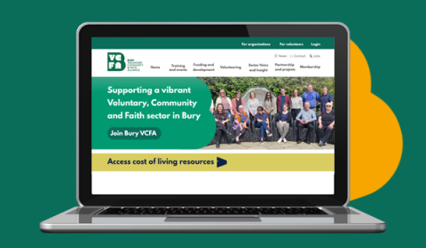 An image of the website home page on a laptop