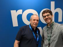 Picture of two men smiling into the camera