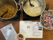 Picture of a hearty lentil curry, rice and coleslaw with recipe cards