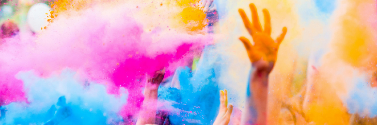 Raised hand in a colour powdered display