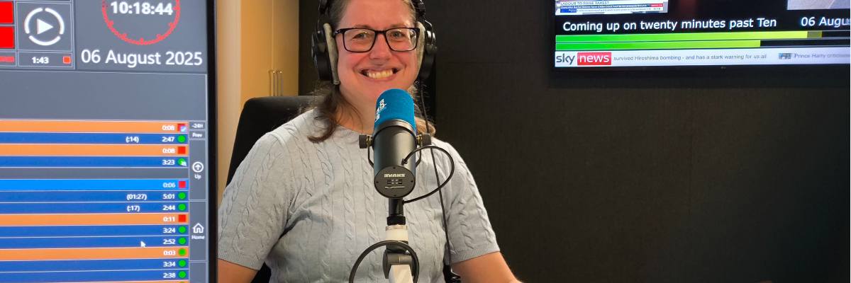 Marie with headphones on at the radio recording studios