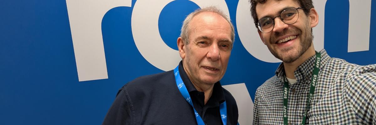 Picture of two men smiling into the camera