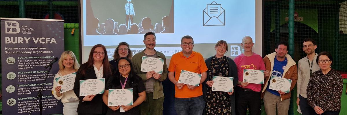 Group of people smiling into the camera