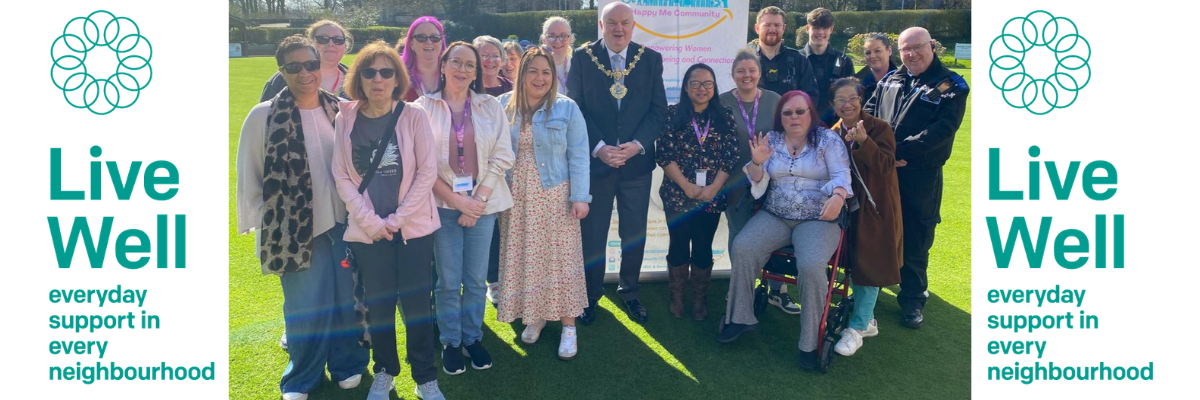 Image of people smiling into the camera