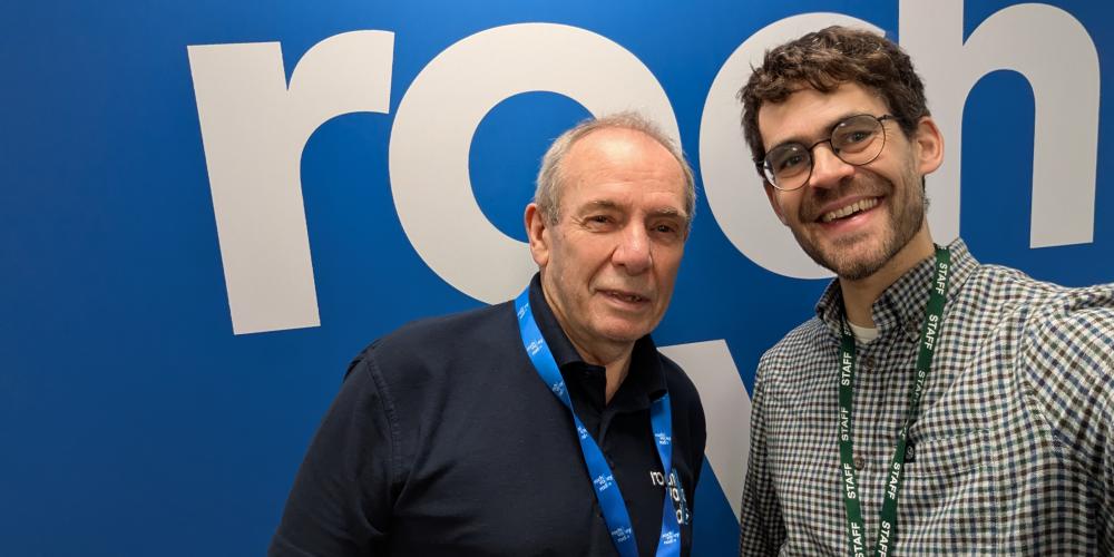 Picture of two men smiling into the camera