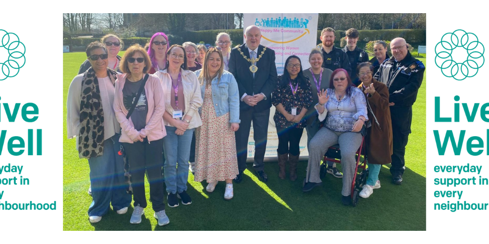 Image of people smiling into the camera